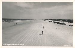 Beachgoers, parked cars, and ocean waves at St. Augustine Beach Postcard