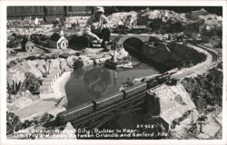 Model Train on Bridge, Lake Scene, Midget City, Florida Postcard