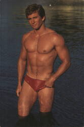 Beefcake Man in Red Swimsuit Postcard