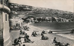 Beachgoers Relaxing on the Shore Postcard