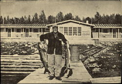 Fisherman with two Large Fish Postcard