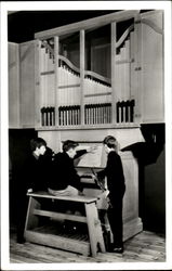 Boys Playing Organ - Coventry Cathedral choir practice room Music Postcard Postcard