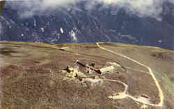 The Summit of Mt. Washington showing Cog Railway and Auto Road Postcard