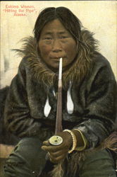 Eskimo Woman Hitting The Pipe Postcard