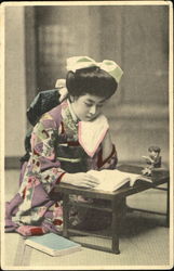 Japanese Girl Studying Postcard