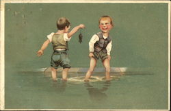 Two boys play in the water while one holds a mouse by the tail Postcard