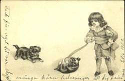 Boy playing with puppies Postcard