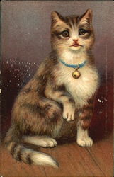 Tabby with a blue collar and bell sitting Postcard