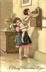 Two kids playing with an old telephone Postcard