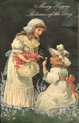 Two young girls picking flowers Postcard