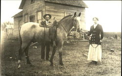 Couple with Horse in Front of House Postcard