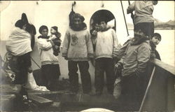 Eskimos on a boat Postcard