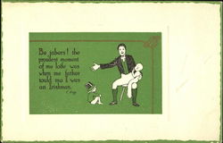 An sitting Irishman holds a baby and has a another child at his feet Postcard