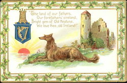 An Irish setter sitting in a field before a castle Postcard