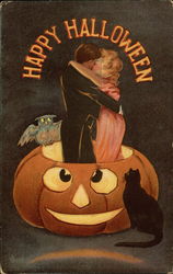 Happy Halloween: Couple Kissing in a Pumpkin Postcard Postcard