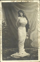 Woman draped in revealing attire Postcard