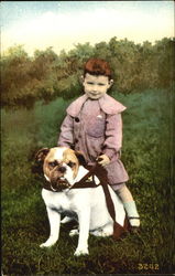 Boy riding a Bulldog Dogs Postcard Postcard