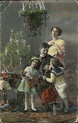 A victorian Family on Christmas day Children Postcard Postcard