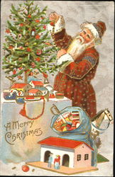 santa in red decorating small tree, little house, bag of toys, horse on floor, small town around tree Santa Claus Postcard Postcard