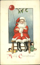 Smiling Santa on a Chair with a Balloon Postcard