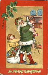 Santa with green robe hangs stocking while girl watches Postcard