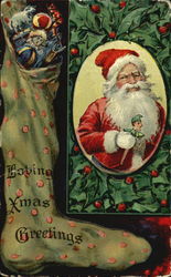 Stocking filled with toys , Santa holding toy surrounded by holly Santa Claus Postcard Postcard