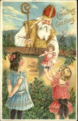 Santa in white and gold handing a child a gift Postcard