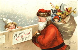 Santa in red robe delivers present to a child Postcard