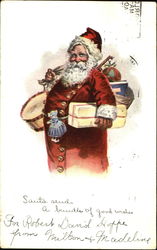 Santa in red suit with many buttons down the front,holding gifts and bag of toys Santa Claus Postcard Postcard