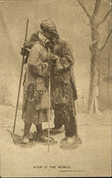 Man and woman in snowshoes kissing Postcard