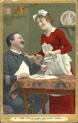 Woman pouring a drink for a man at table Postcard