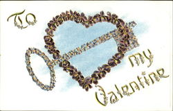 Heart made of flowers with a key made of flowers going thur the heart Postcard