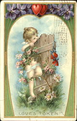 Cupid hanging on old wooden fence Postcard Postcard