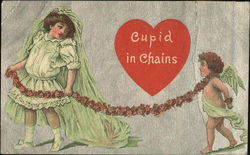 Girl in green dress & vail, flower chain attached to cupid Postcard