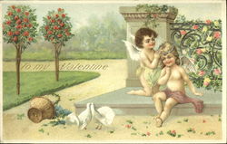 Cherub fixing second cherib's head wreath Postcard