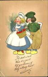 Dutch boy and girl with basket of heart tarts Postcard