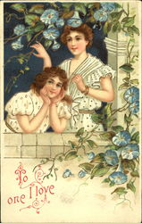 Two girls on a parapet surrounded by blue flowers Postcard