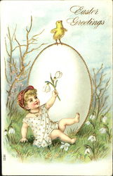 Child in red cap sitting next to big white egg with gold trim Postcard