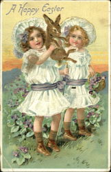 Two pretty girls holding a bunny With Bunnies Postcard Postcard