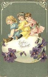 Three pretty children sitting on a huge Easter egg With Children Postcard Postcard