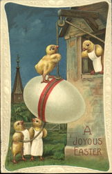 Four chicks, hoisting egg into building Postcard