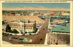 View looking north showing Spokane Club and Monroe Street Bridge Postcard