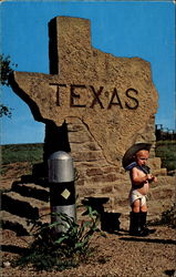 Baby Cowboy Standing in Front of Texas Stone Marker Postcard