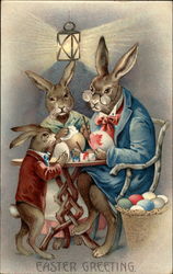 Rabbit family decorating Easter eggs With Bunnies Postcard Postcard