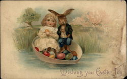 Bunny and child in an egg boat Postcard