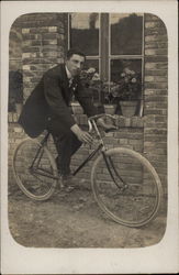 A Man Astride His Bicycle Postcard