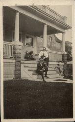 Two Men Sitting on the Front Porch Steps Postcard