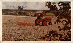 Farmer plowing a field on an Allis-Chalmers Model C tractor Farming Postcard Postcard