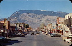 View of Main Street and Rattlesnake Mountain Cody, WY Postcard Postcard