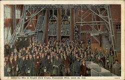 Homestake Mine, lowering men in double-deck cages Postcard